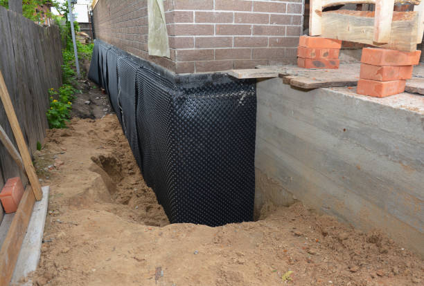 SJ Waterproofing Pros technician performing targeted Exterior Waterproofing assessment in Granger, IN